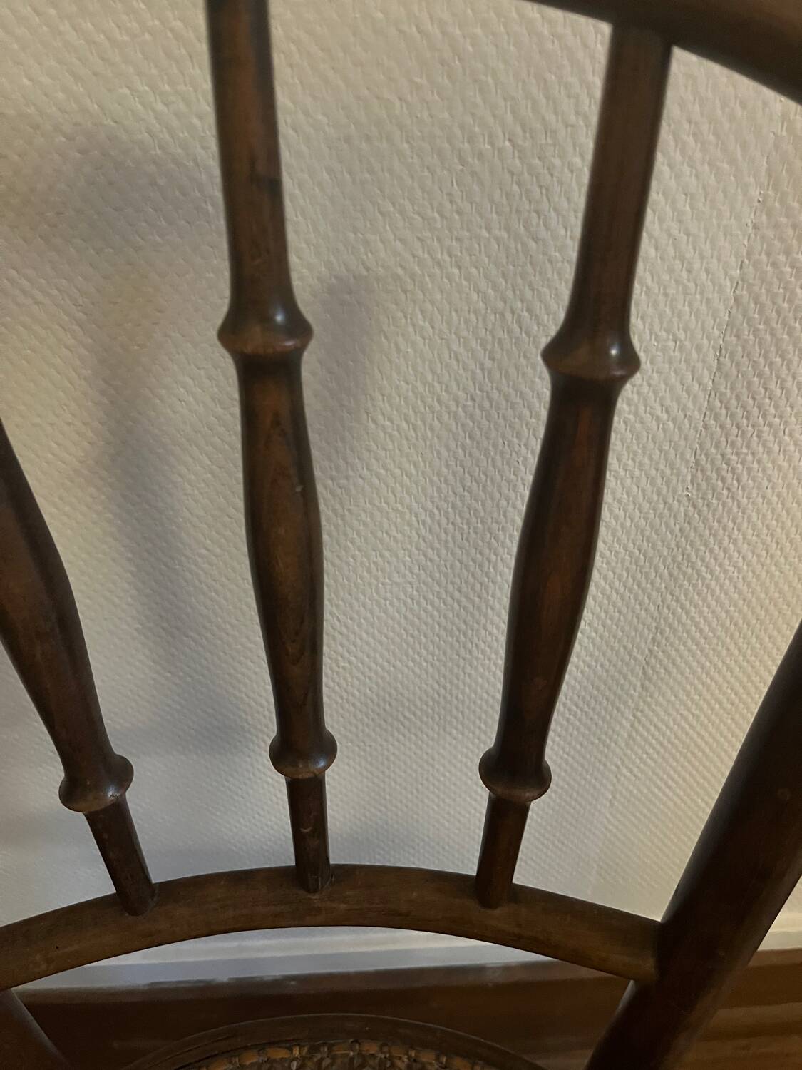 Pair of antique caned bistro chairs stamped Fischel