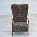 1960s, reupholstered Danish armchair, with stool, genuine sheepskin.