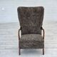 1960s, reupholstered Danish armchair, with stool, genuine sheepskin.