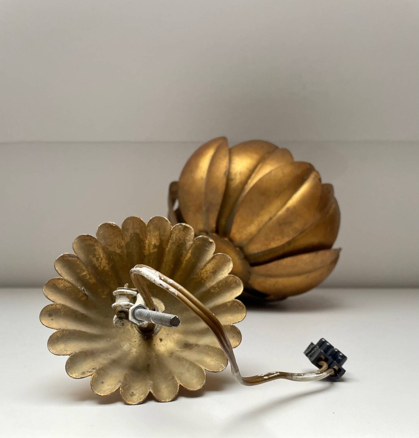 Two vintage pendant lights in gold metal