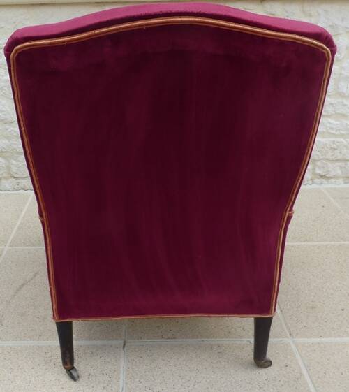 Bergère with blackened wooden legs on casters, Napoleon III period, velvet upholstery