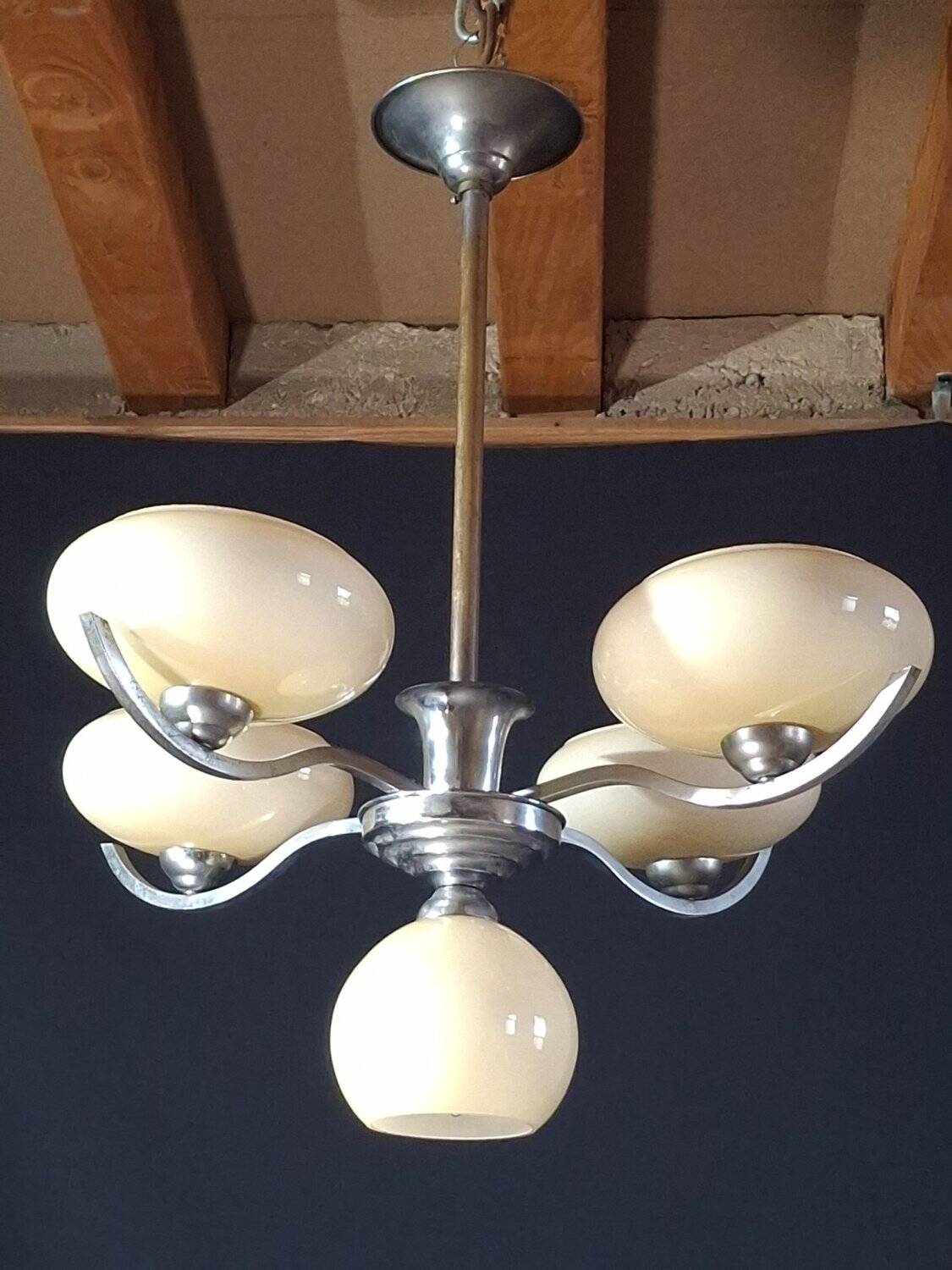Chrome metal chandelier with 5 pale yellow opal shades from the 1950s.