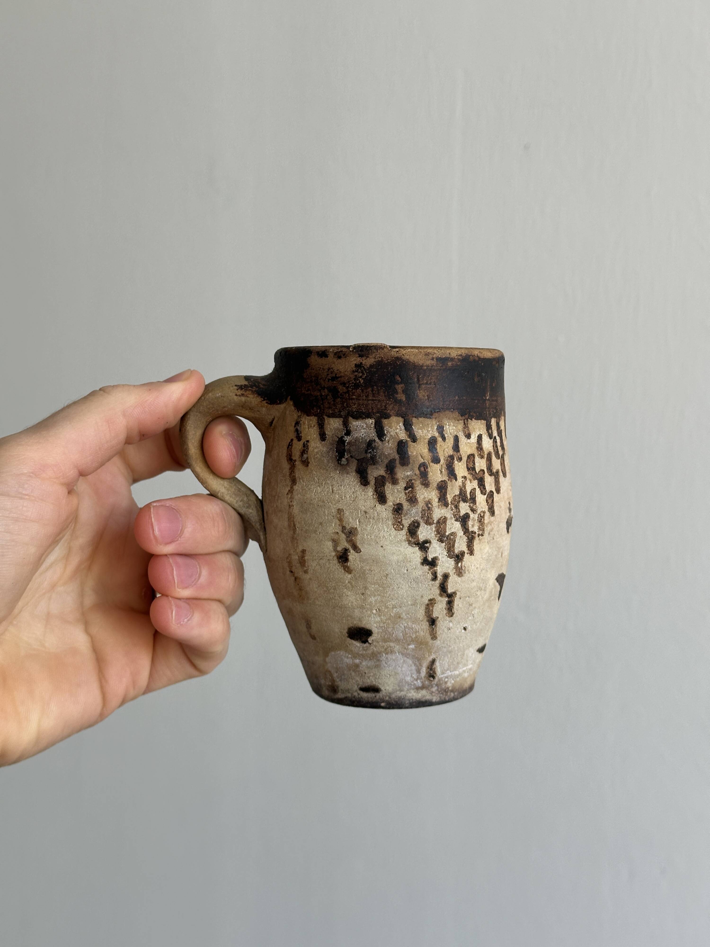 Small old terracotta cup
