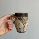 Small old terracotta cup