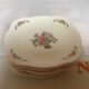 Six small Raynaud Limoges flower plates