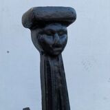 Pair of cast iron chenets with stylized faces High Epoch SEVENTEENTH century