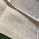 12 damask linen table napkins with an antique silk monogram from the 19th century.