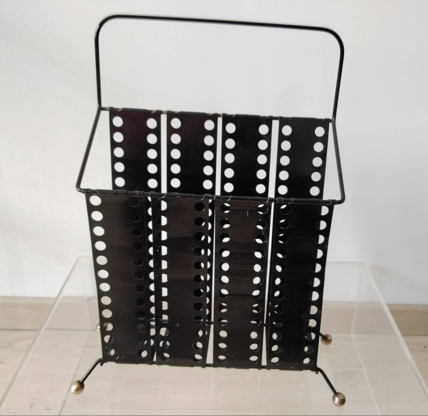 “Santiago” magazine rack in perforated sheet metal Mathieu Mategot 1950s