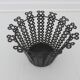 Perforated black metal cachepot from the 1950s and 1960s.