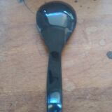 Rice spoon covered with serving in Asian handicraft horn