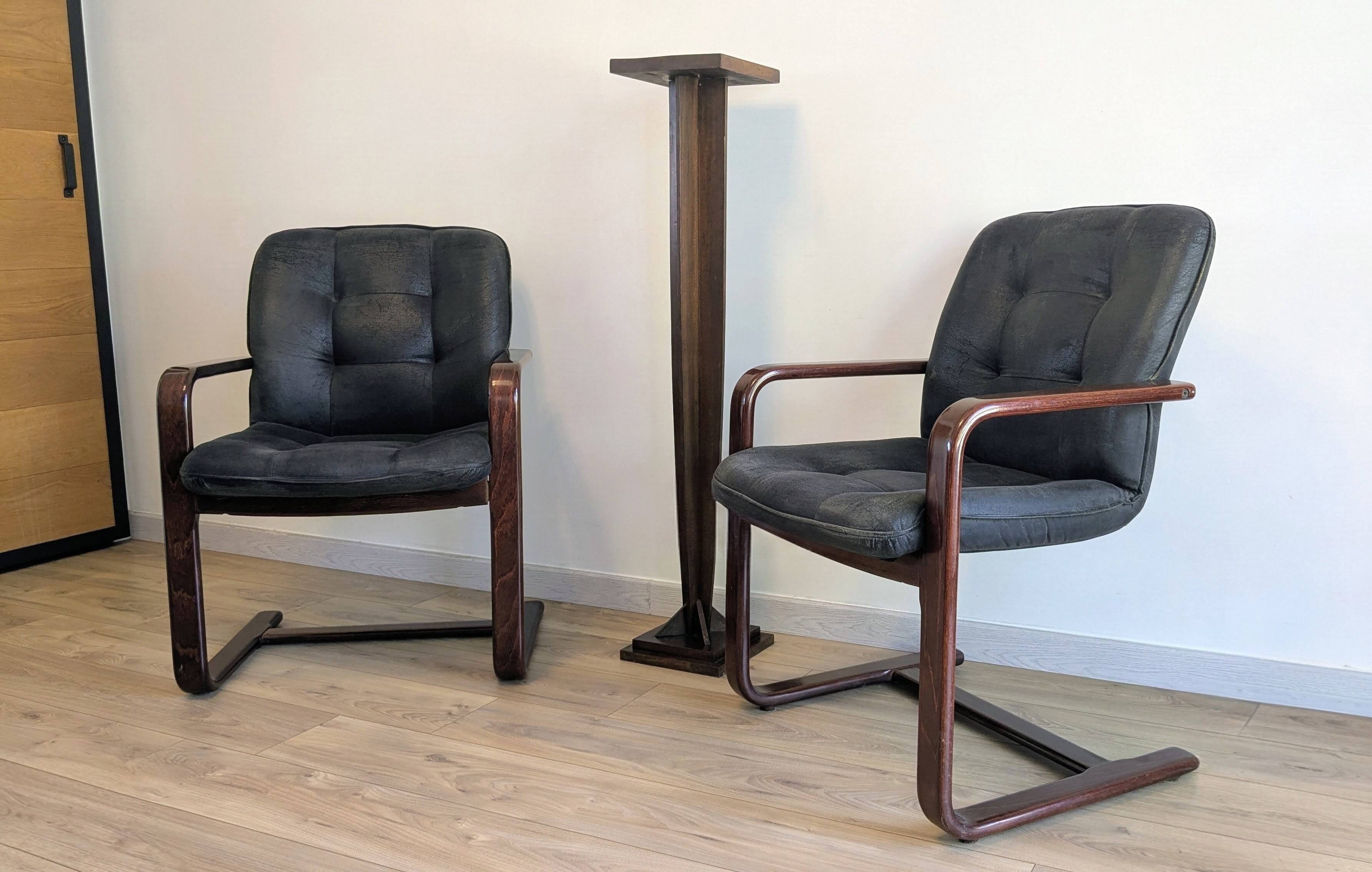 Pair of vintage cantilever armchairs in rosewood veneer.