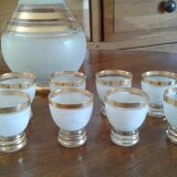 8 glasses and bottle with cap