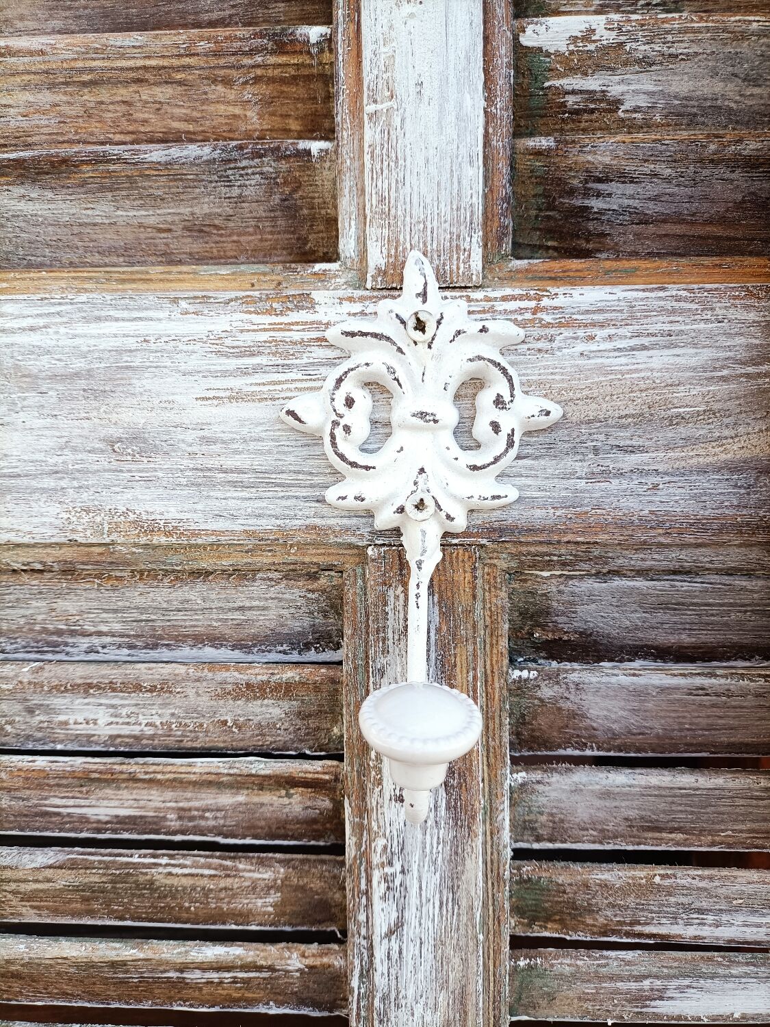 Vintage shutter renovated into a coat rack