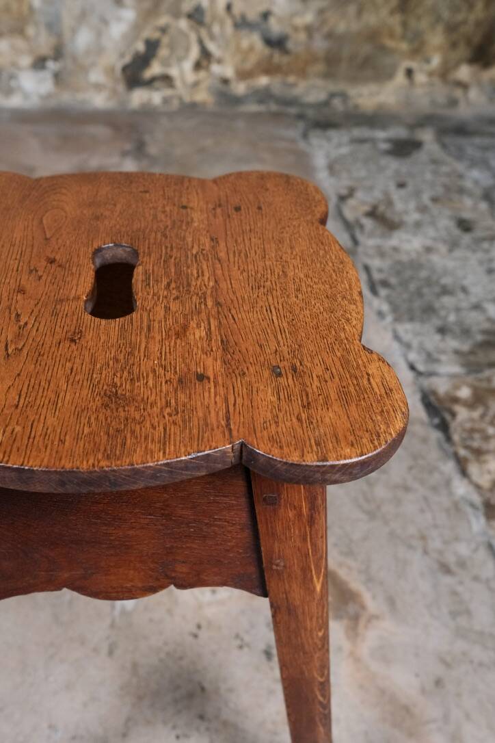 Pair of scalloped oak stools, France, early 20th century