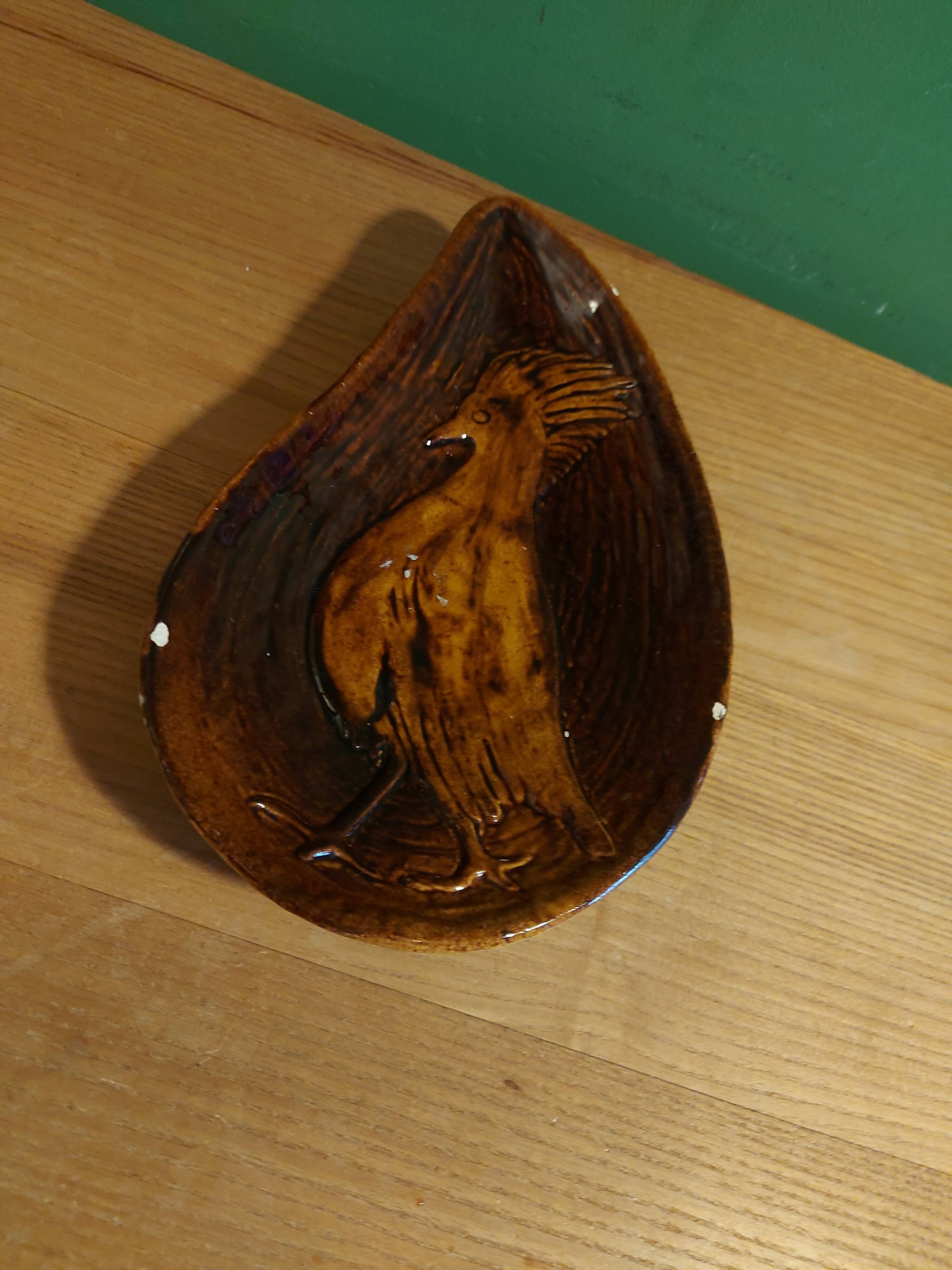 Empty pocket with vallauris bird decoration