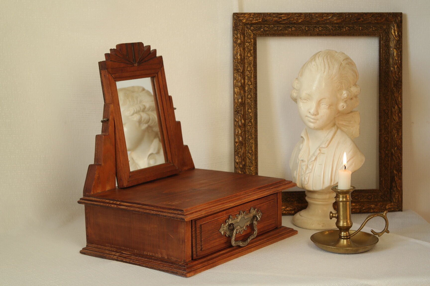 Antique wooden table mirror in Art Deco style.