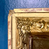 Mirror XIXth medallion on gilded frame with leaf