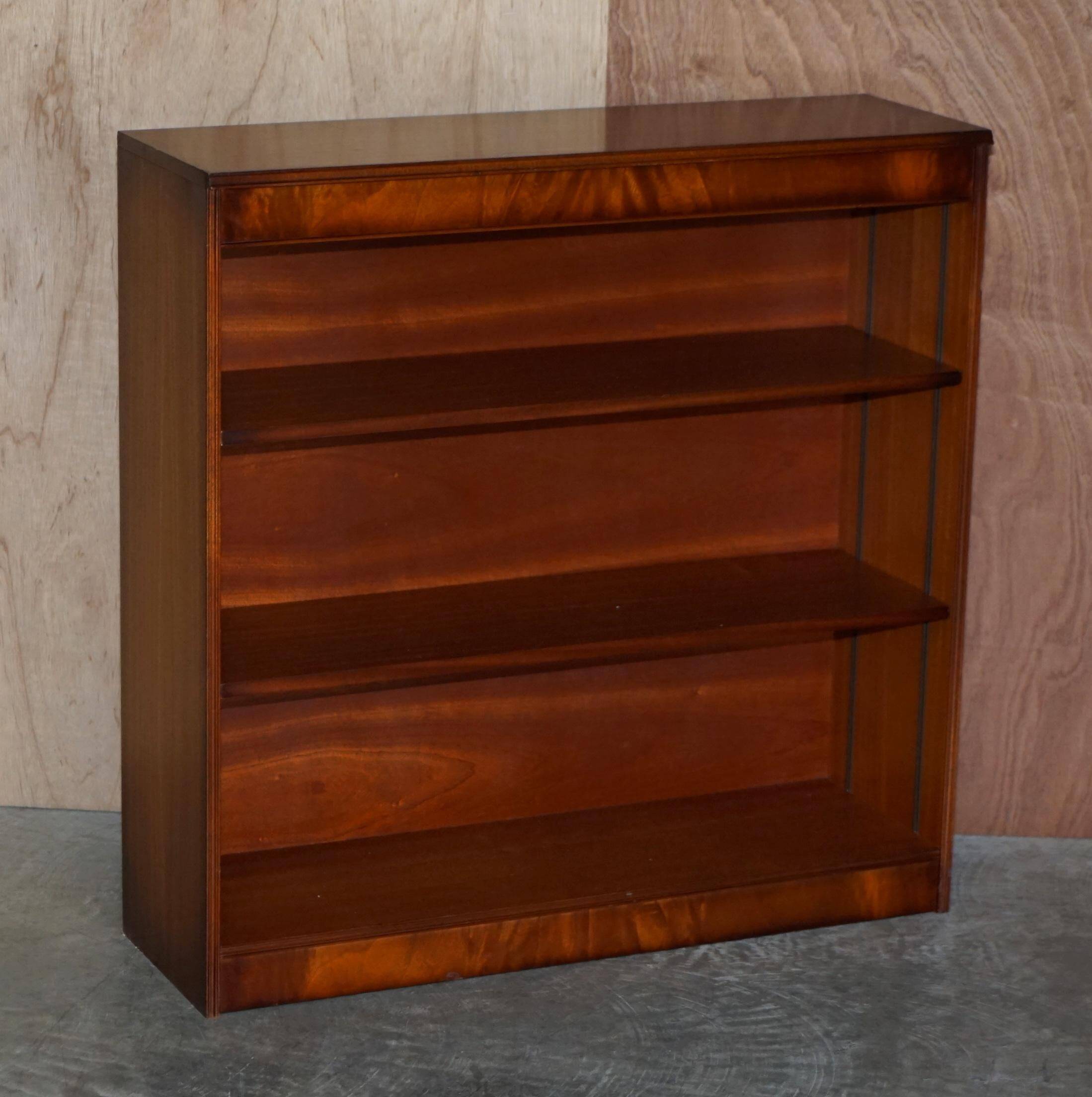 Pair of open dwarf bookshelves in mahogany by Shaws of London.