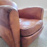 Fauteuil club en cuir patiné