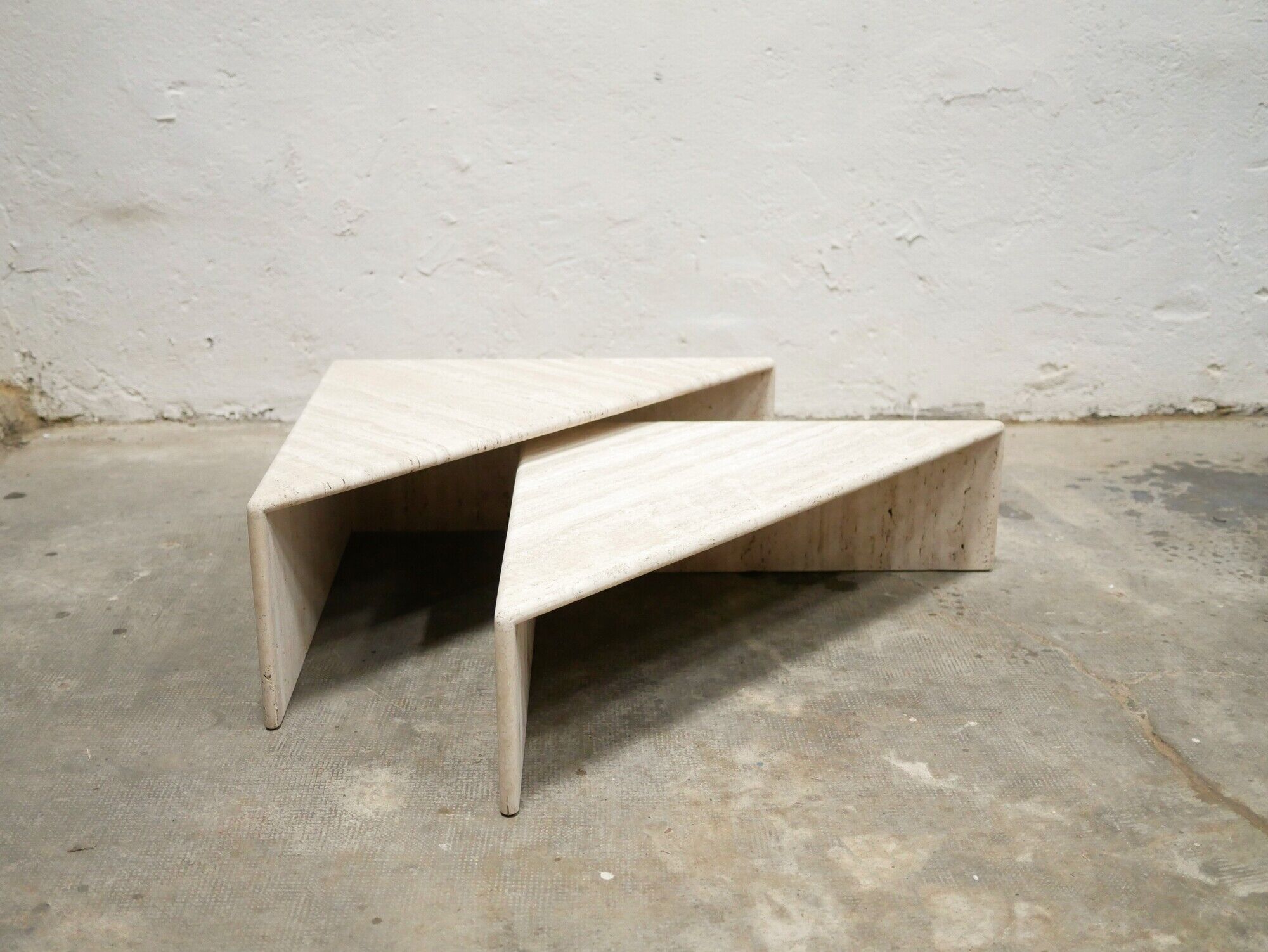Series of 2 vintage travertine coffee tables published by Roche Bobois