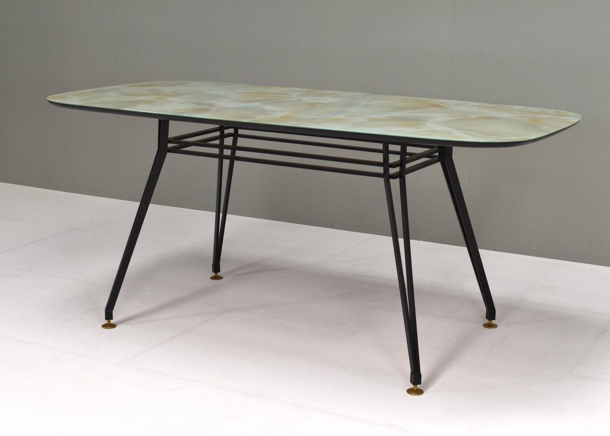 Italian dining table with metal base and glass top and brass, 1950s