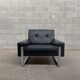 Pair of black leather armchairs