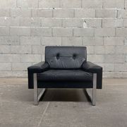 Pair of black leather armchairs