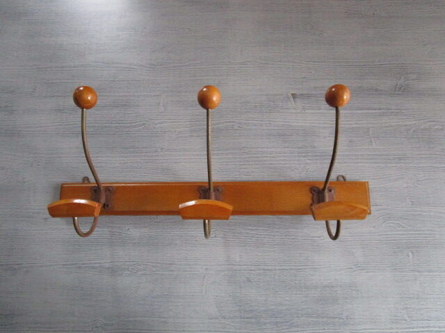 Old coat hangers in wood and metal