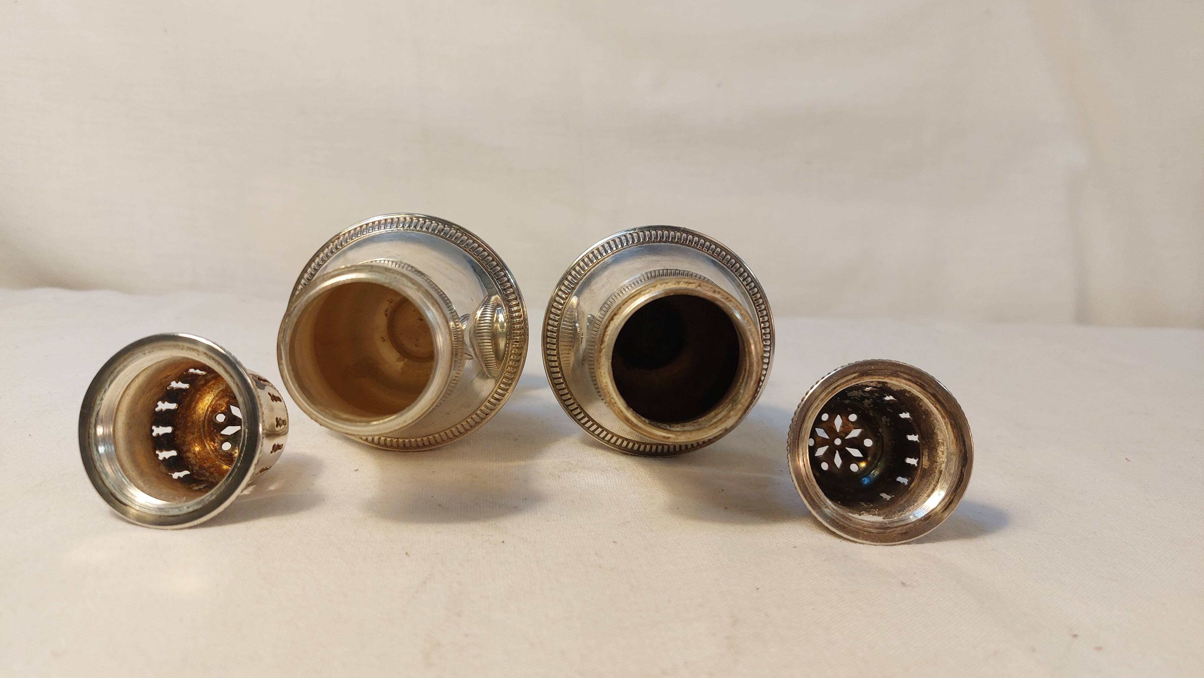 Set of two silver metal sprinklers