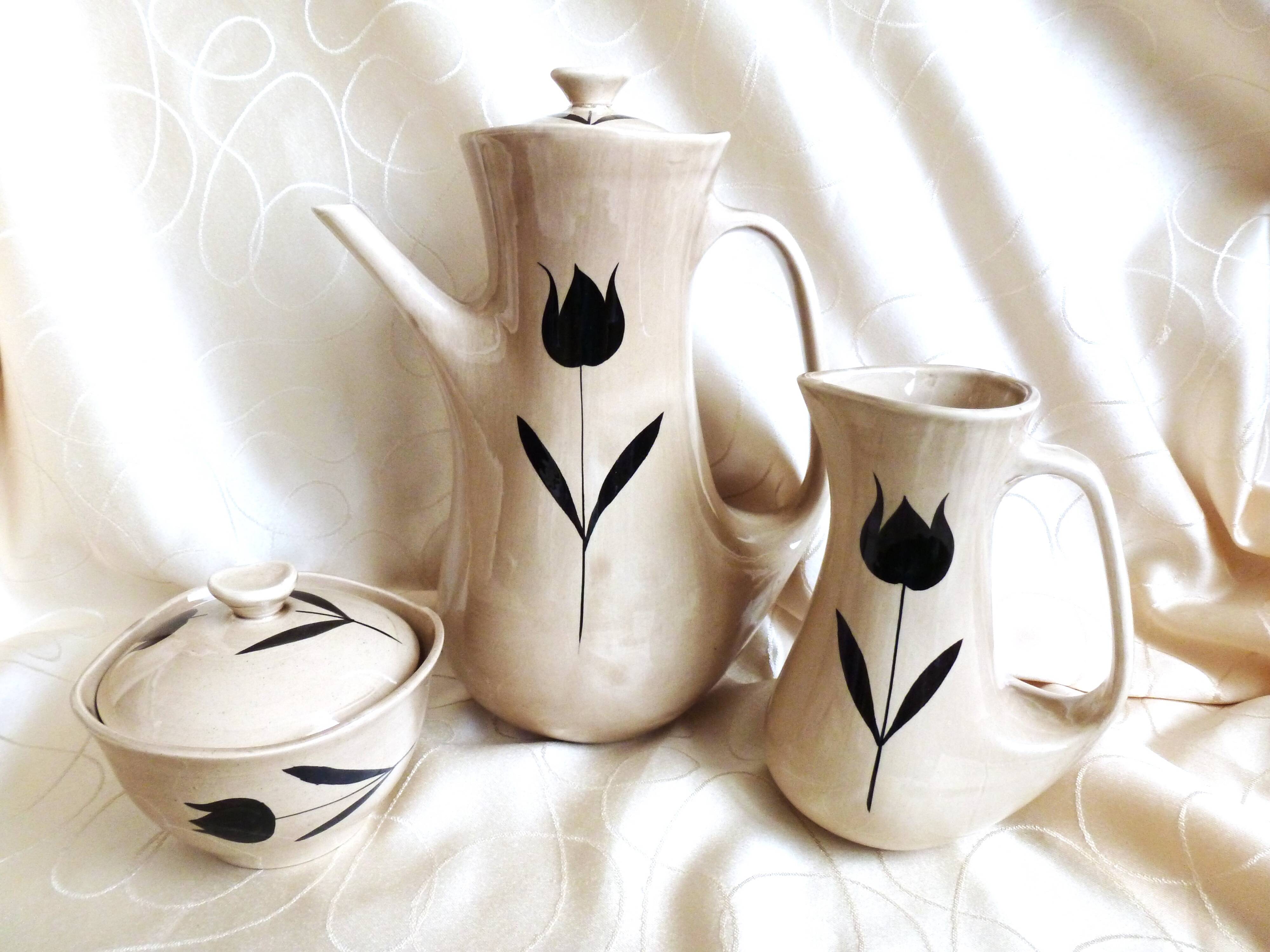 Vintage 23-piece Niderviller coffee set with hand-painted black tulip decor.