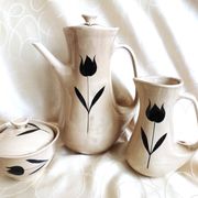 Vintage 23-piece Niderviller coffee set with hand-painted black tulip decor.
