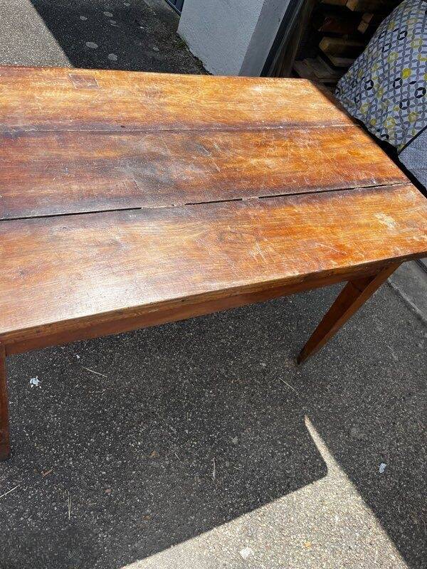 Old wooden table with a drawer