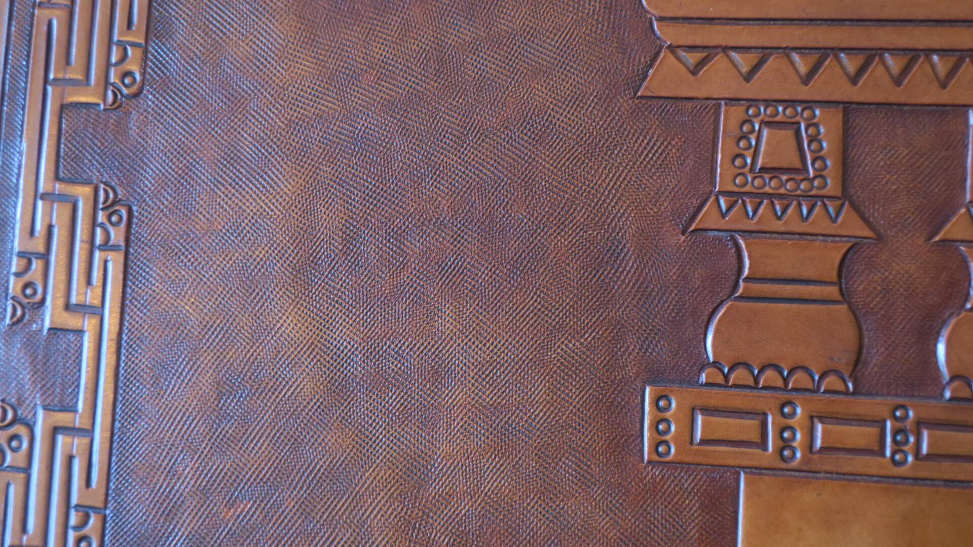 Tiahuanaco design tooled leather folding armchair by Angel Pazmino, Ecuador