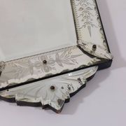 Venetian wall mirror in Murano glass with faceted floral decoration from the 1930s.
