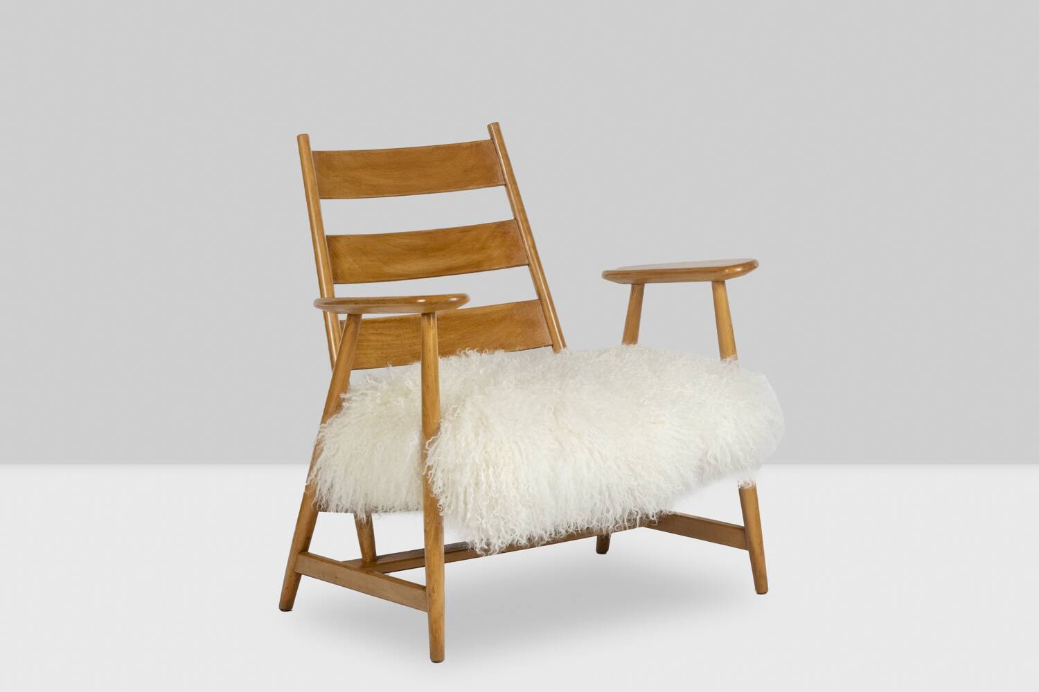 Pair of “lounge” armchairs in blond beech. 1950s