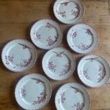 A series of eight flat plates in Terre de fer earthenware, Favori aux oiseaux model - pink tint