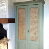 Caned cabinet with oranges