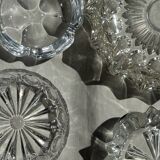 Circular glass ashtray with stylized petal patterns