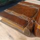 Wooden trompe-l'œil bookends with a book and box