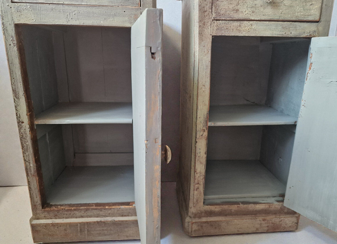 Pair of antique bedside tables with a green patina