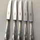 10 Series of 10 silver metal knives François Frionnet