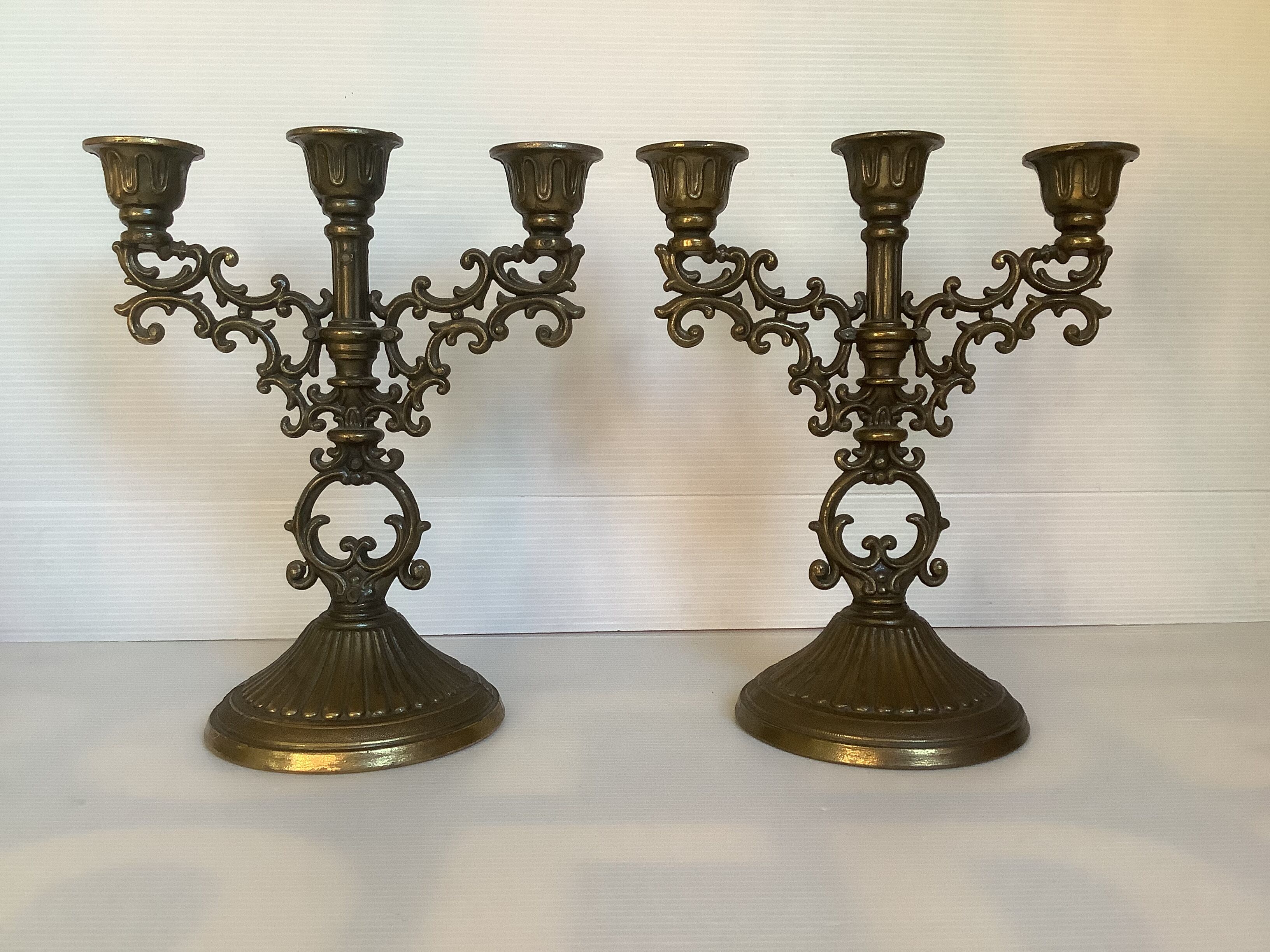 Pair of baroque brass candle holders