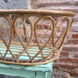 Rattan bassinet with hood arches