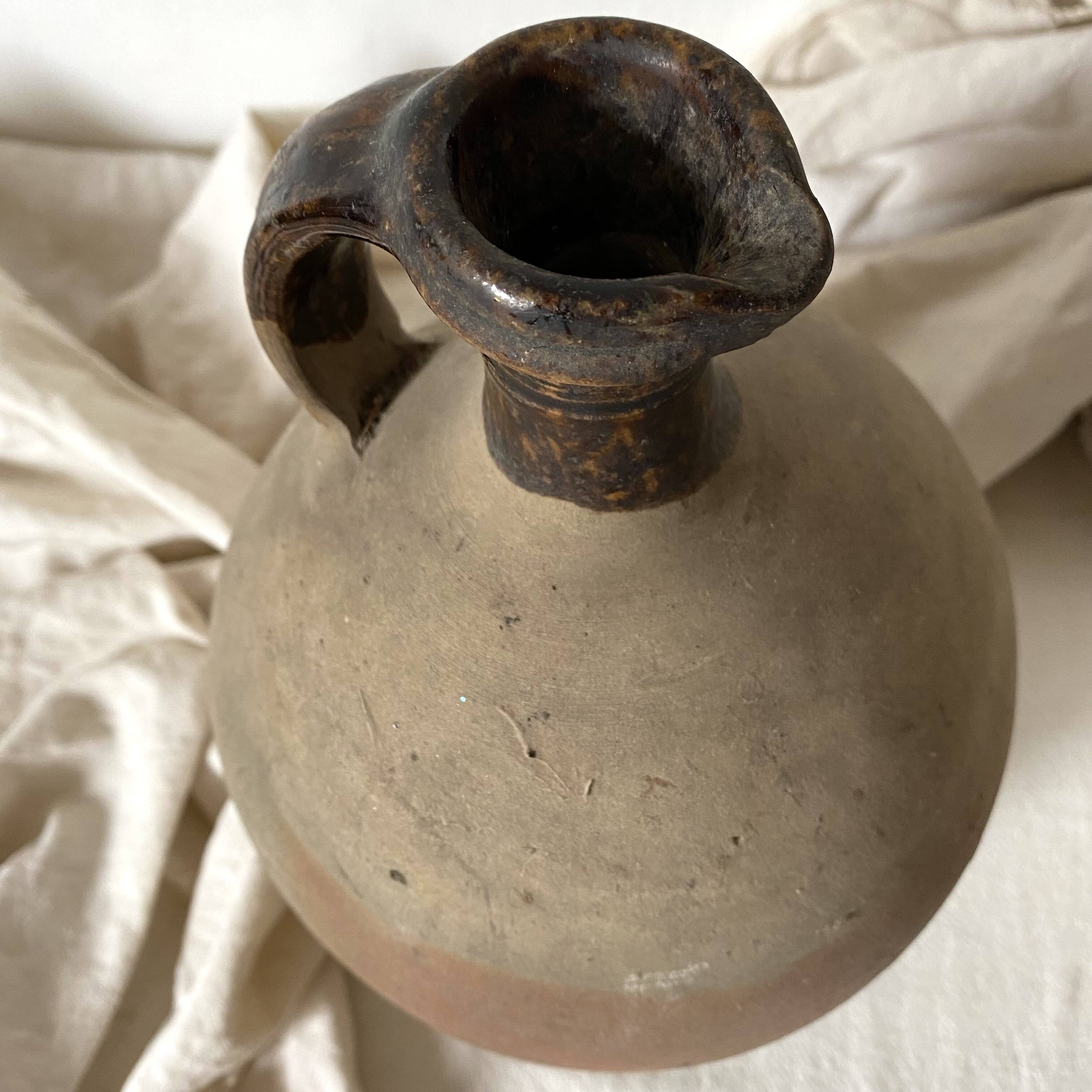 Antique jug, terracotta jar