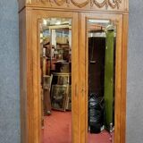 Armoire a miroirs style louis XVI en noyer a patine blonde vers 1880