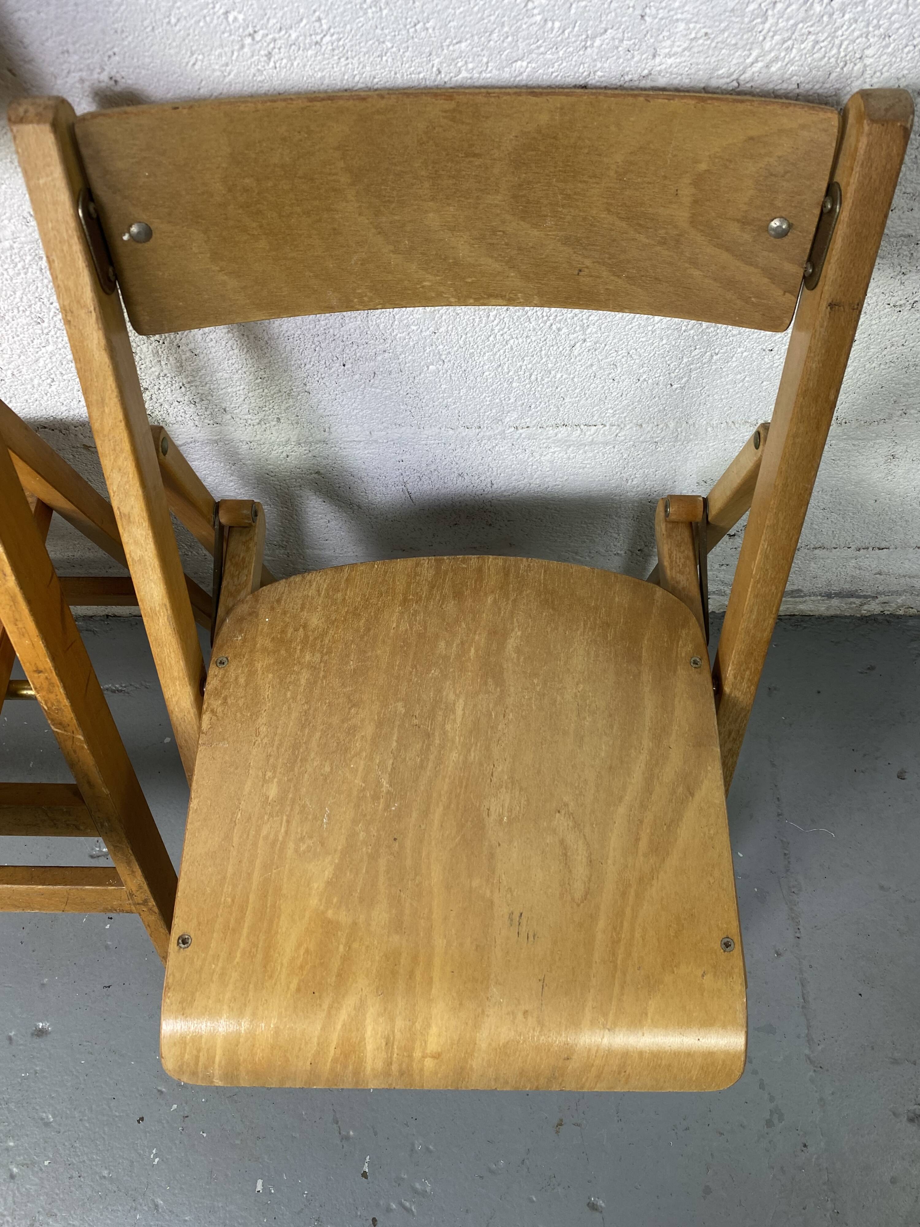 Pair of mismatched wooden folding chairs