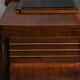 Art Deco walnut sideboard with brass details and sculptural base, France, 1930s