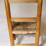 Old child chair in wood and straw