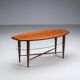 Assymetrical coffeetable with glass storage and cross leg details