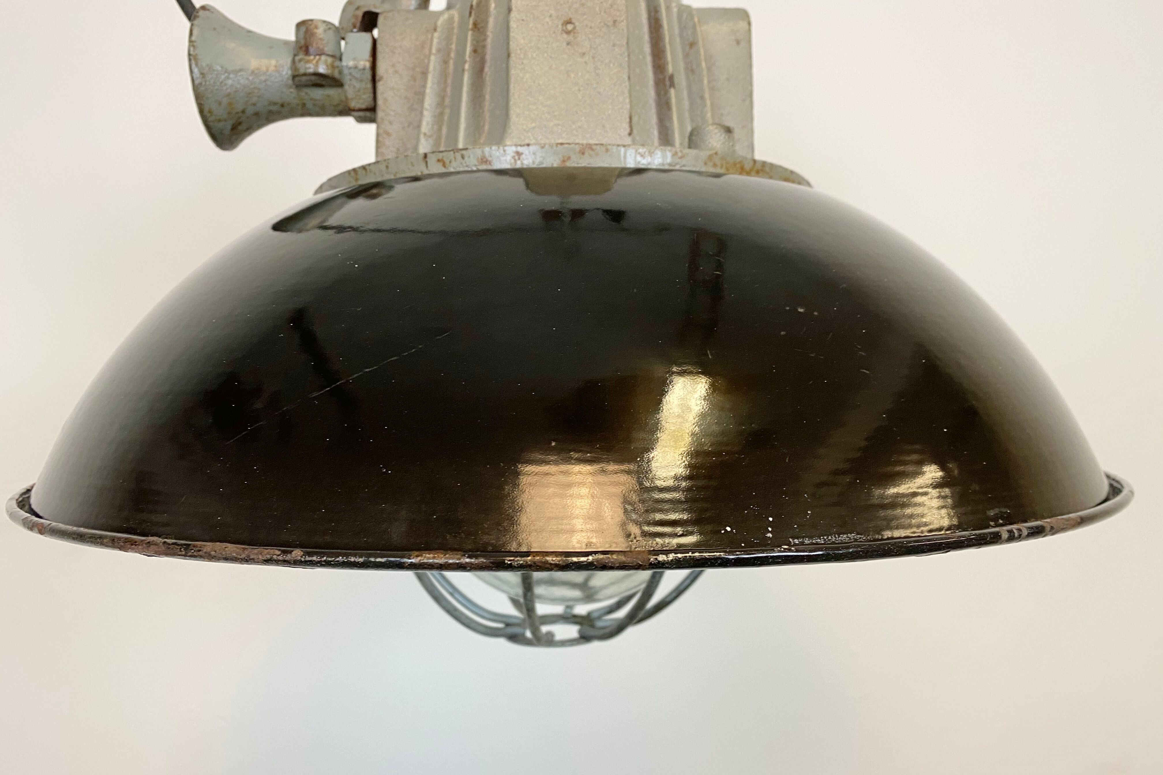 Black enamel and cast iron industrial cage pendant light , 1950s